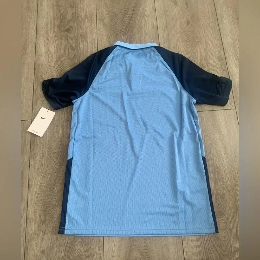Nike youth unisex football/soccer polo shirt.